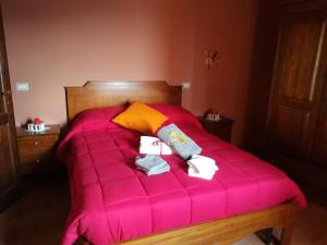 Postel nebo postele na pokoji v ubytování Le Case dell'Arco – Monte San Vito