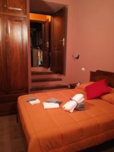 Postel nebo postele na pokoji v ubytování Le Case dell'Arco – Monte San Vito
