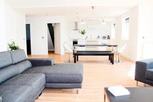 a living room with a couch and a table at Lux Apartment in Bangor