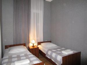 Postel nebo postele na pokoji v ubytování Guest House T&N
