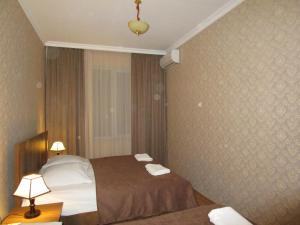 Postel nebo postele na pokoji v ubytování Guest House T&N