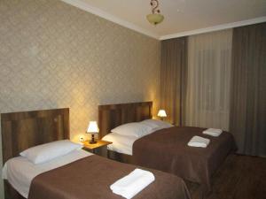 Postel nebo postele na pokoji v ubytování Guest House T&N