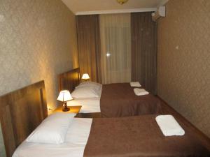 Postel nebo postele na pokoji v ubytování Guest House T&N