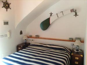 Postel nebo postele na pokoji v ubytování Villa La Zagara