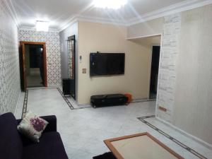 Télévision ou salle de divertissement dans l'établissement Apartment at Milsa Nasr City, Building No. 22