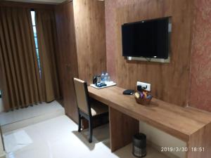 TV a/nebo společenská místnost v ubytování Hotel West Blue