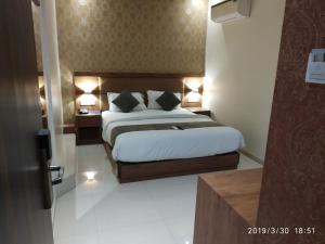 Postel nebo postele na pokoji v ubytování Hotel West Blue