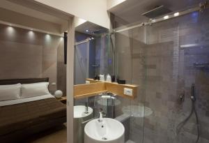 a bathroom with a sink and a shower at MaisonSilvi' in Matera