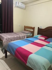 Кровать или кровати в номере Apart-Norte Flat Belém Aeroporto
