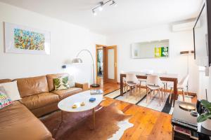 a living room with a couch and a table at LV Premier Apartments Baixa- PR in Lisbon