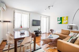 a living room with a couch and a table at LV Premier Apartments Baixa- PR in Lisbon