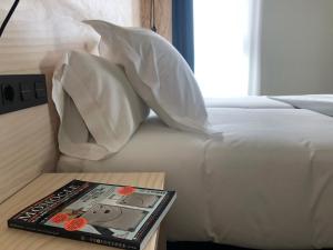 Talo Urban Rooms客房内的一张或多张床位