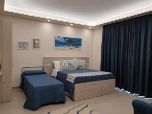 a bedroom with two beds and a window at Villa Eden in Corbara +57 photos