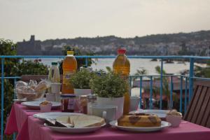 a table with plates of food and bottles of drinks at Oasis in Acitrezza