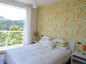 Postel nebo postele na pokoji v ubytování Hotel Garazar
