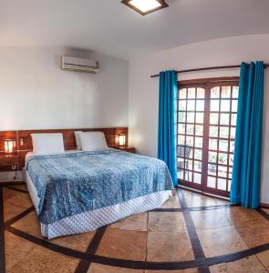 Uma cama ou camas num quarto em Pousada Tranquilandia Village