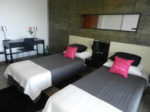 Postel nebo postele na pokoji v ubytování Hotel Garazar