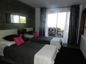 Postel nebo postele na pokoji v ubytování Hotel Garazar