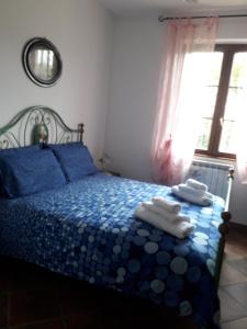 Säng eller sängar i ett rum på Il Castellare