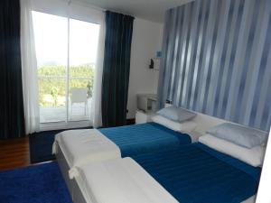 Postel nebo postele na pokoji v ubytování Hotel Garazar + 28 fotografií