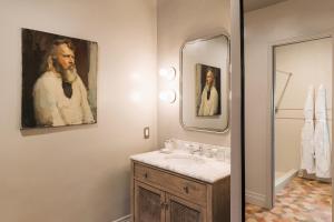 a bathroom with a sink and a mirror at Palihotel Westwood Village - West Beverly Hills in Los Angeles +32 photos