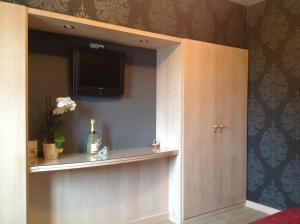 TV a/nebo společenská místnost v ubytování B&B Decoster