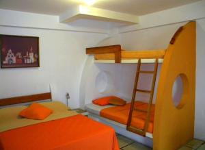 Rúm í herbergi á Hotel Cocos