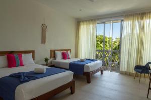 Ένα ή περισσότερα κρεβάτια σε δωμάτιο στο Suites Cielo y Mar +99 φωτογραφίες