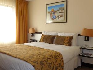 Cama ou camas em um quarto em Park Hotel Calama