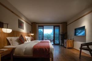 Voodi või voodid majutusasutuse The Apsara Lodge toas
