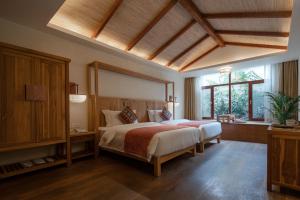 Voodi või voodid majutusasutuse The Apsara Lodge toas