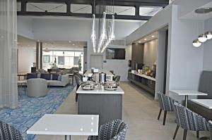 a restaurant with chairs and tables and a lobby at Best Western Plus Executive Residency Oklahoma City I-35 in Oklahoma City