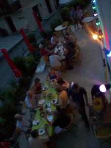 a group of people sitting at a long table at Le Vin de l'Eté in Ponet-et-Saint-Auban
