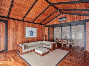 a living room with a couch and a table at Taj Exotica Resort & Spa, Andamans in Havelock Island