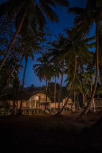 a resort with palm trees in front of it at Taj Exotica Resort & Spa, Andamans in Havelock Island