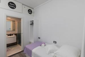 Ein Bett oder Betten in einem Zimmer der Unterkunft Guest House Tomasi One