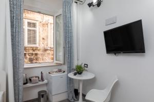 Ein Badezimmer in der Unterkunft Guest House Tomasi One