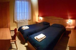 Llit o llits en una habitació de Lozzo di Cadore - Dolomiti - Piazza IV novembre