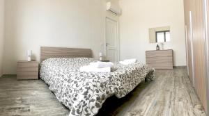 Posteľ alebo postele v izbe v ubytovaní Casa Vacanza Gemini + 10 fotografií