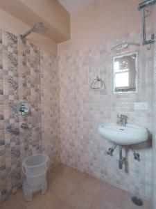 a bathroom with a sink and a toilet at Travelling Troopers Homestay in Varanasi