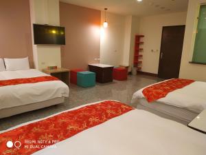 Postel nebo postele na pokoji v ubytování Sun Moon Lake Crown Yu Hotel