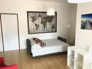 a bedroom with a bed with a map on the wall at La Casa Di Camp - Apartment in Rome