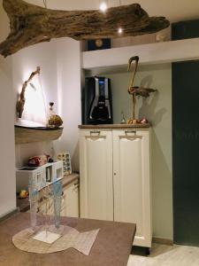 a kitchen with a counter with a microwave on it at Dimore di Mare in San Pietro Vernotico