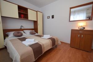 Postel nebo postele na pokoji v ubytování Apartments Anka