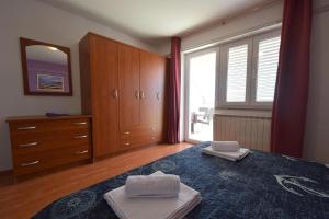 Postel nebo postele na pokoji v ubytování Apartments Anka