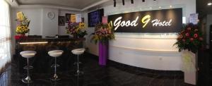 a flower shop with stools in front of a counter at GOOD 9 HOTEL - Bukit Dahlia in Johor Bahru