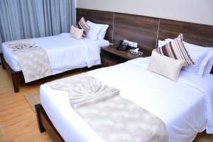 Razana Hotel客房内的一张或多张床位