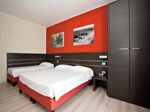 Posteľ alebo postele v izbe v ubytovaní Hotel Vienna