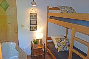a small room with a bunk bed and a table at Gîte Marius in Mirabel-aux-Baronnies +24 photos