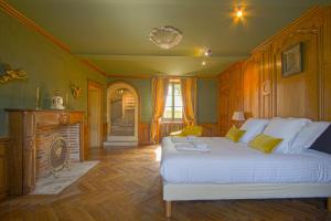 Postelja oz. postelje v sobi nastanitve Château de Monceaux 5mn de Bayeux proche Mer